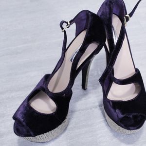 Purple suede heels.